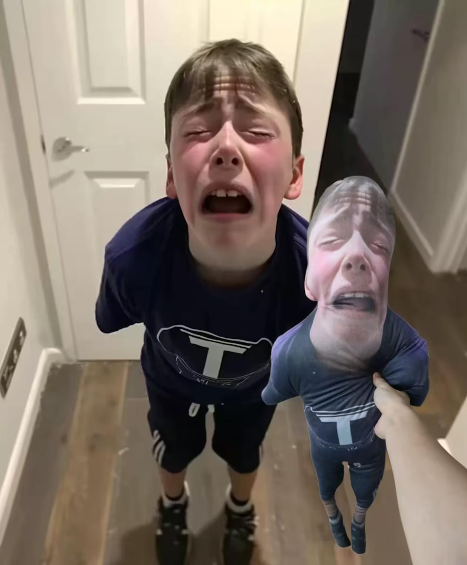 Boy holding a custom mini-me pillow of himself, a viral meme gift